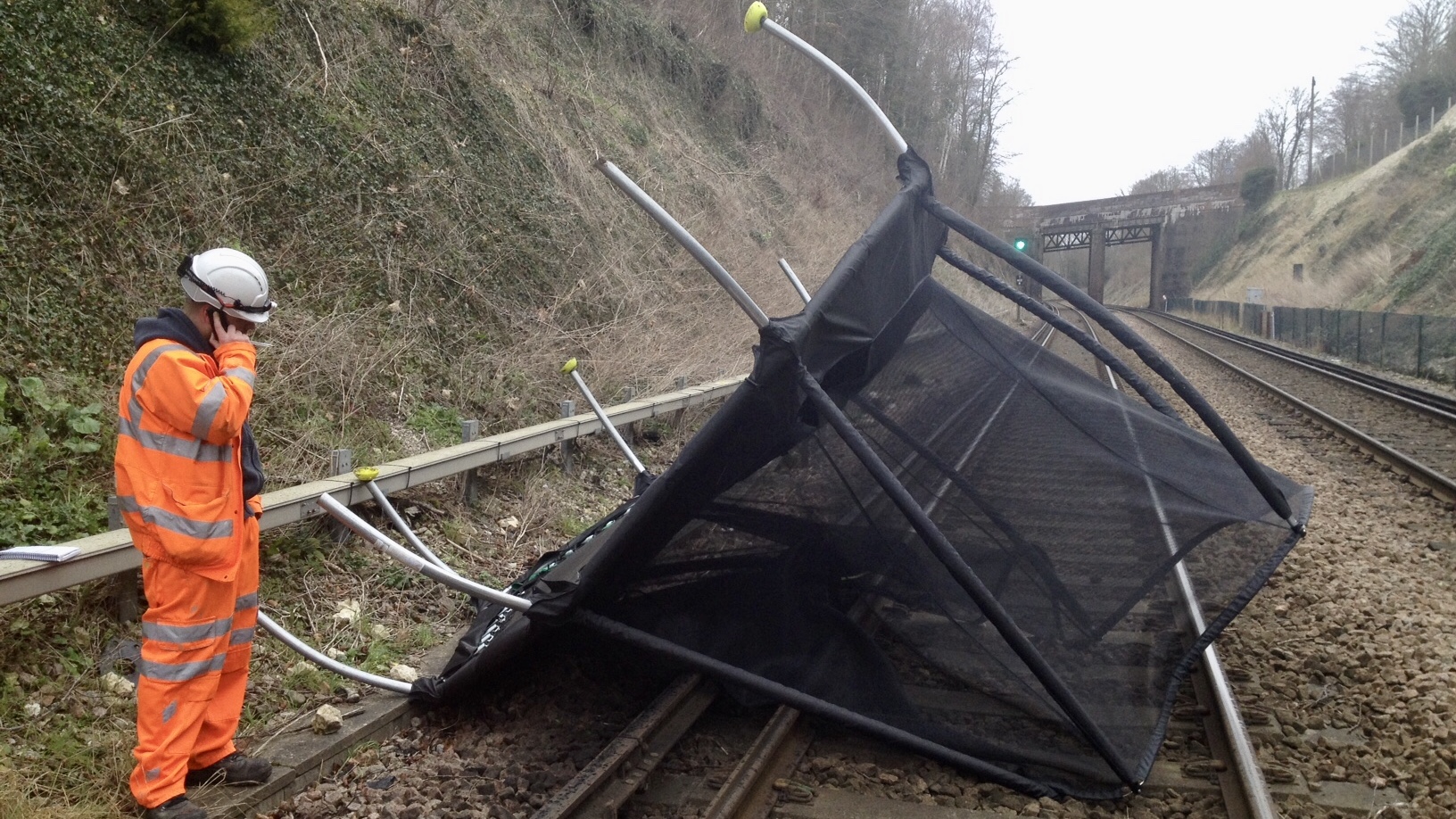 A trampoline blown onto a railway track be strong winds. Picture from Network Rail